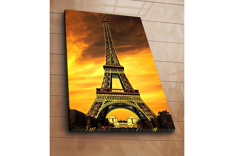 Lærred 70x100 cm - Eiffeltårnet mod en dramatisk solnedgang - Guld / Orange / Sort - Boligtilbehør - Billeder & kunst - Billeder på lærred