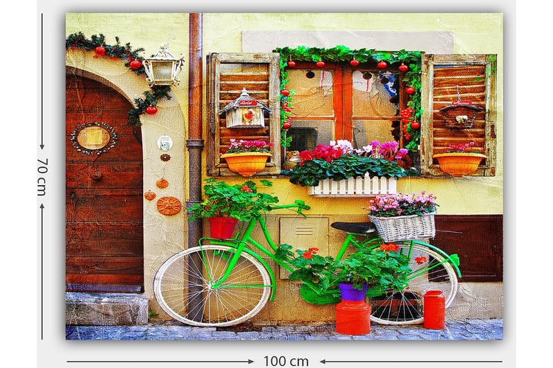 Lærred 70x100 cm - Farverig cykel pyntet med blomster og potter foran en charmerende væg med vinduer og dekorationer - Grøn / Lyserød / Orange - Boligtilbehør - Billeder & kunst - Billeder på lærred