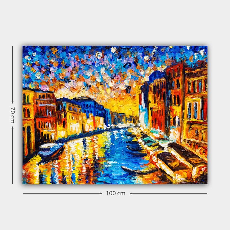 Lærred 70x100 cm - Farverig udsigt over en kanal med bygninger og både under en solnedgang i en by - Blå / Orange / Gul - Boligtilbehør - Billeder & kunst - Billeder på lærred