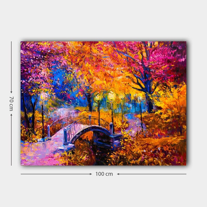 Lærred 70x100 cm - Farverigt efterårsscene med en bro, der spænder over en stille vandoverflade, omgivet af træer i varme efterårsfarver - Orange / Lilla / Gul - Boligtilbehør - Billeder & kunst - Billeder på lærred