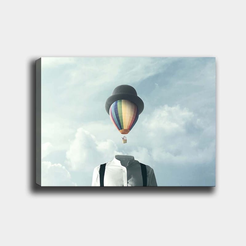 Lærred 70x100 cm - Hovedløs mand i hvid skjorte og sort hat med en farverig varmluftballon svævende over sig, Hvid / Sort / Regnbue
