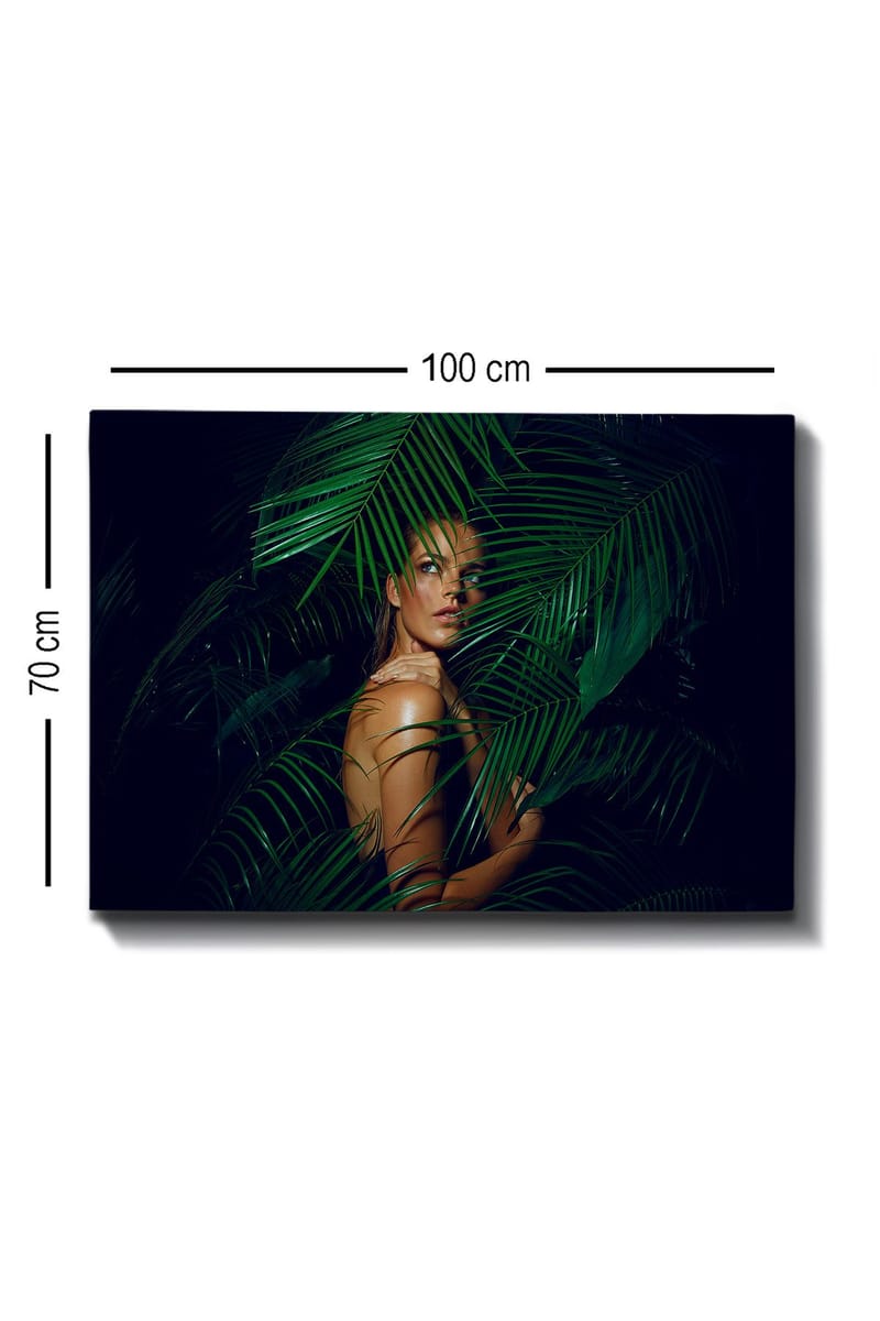 Lærred 70x100 cm - Kvinde delvist skjult bag grønne palmeblade - Mørkegrøn / Lysegrøn / Beige - Boligtilbehør - Billeder & kunst - Billeder på lærred