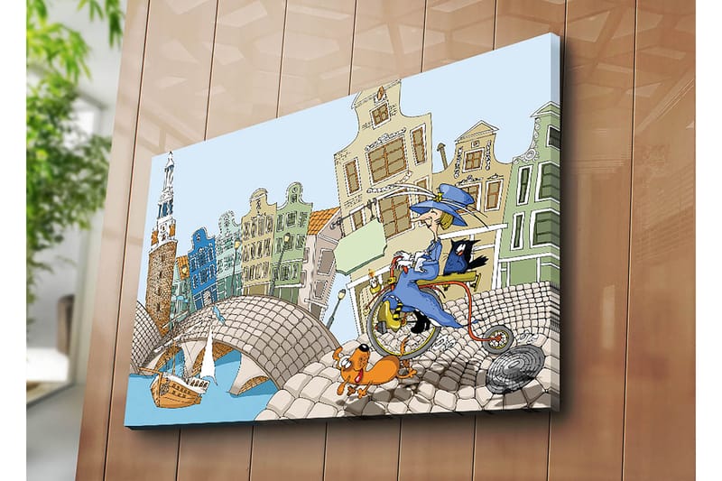 Lærred 70x100 cm - Kvinde på cykel med hund og kat, omgivet af farverige huse og en bro - Blå / Grøn / Orange - Boligtilbehør - Billeder & kunst - Billeder på lærred