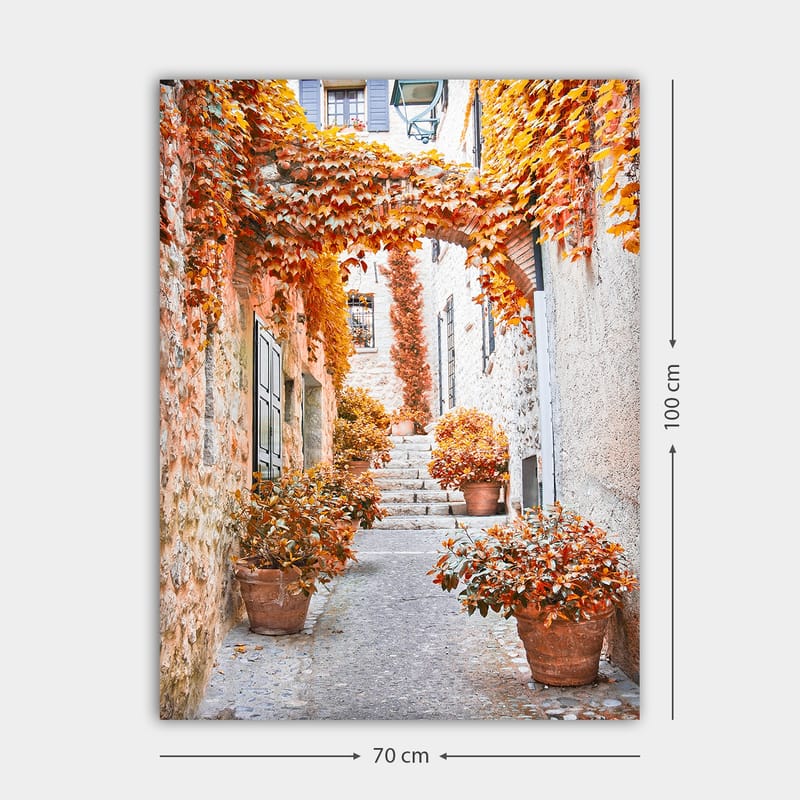 Lærred 70x100 cm - Malerisk gyde omgivet af farverige efterårsblade og potteplanter - Orange / Brun / Gul - Boligtilbehør - Billeder & kunst - Billeder på lærred