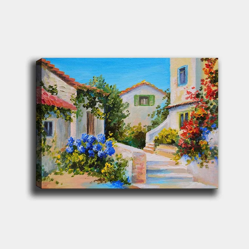 Lærred 70x100 cm - Malerisk landsbyscene med farverige huse og blomstrende planter, Blå / Grøn / Gul