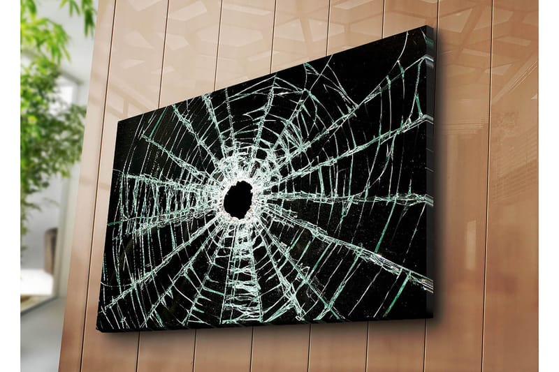 Lærred 70x100 cm - Nærbillede af en revnet glasrude med et hul i midten og revner, der strækker sig udad - Sort / Gennemsigtig - Boligtilbehør - Billeder & kunst - Billeder på lærred