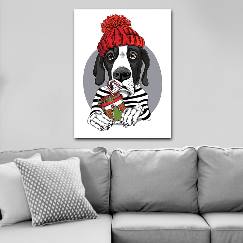 Lærred 70x100 cm - Sød hund i en rød hat, der holder en julegave med en slikbar - Rød / Sort / Grøn - Boligtilbehør - Billeder & kunst - Billeder på lærred