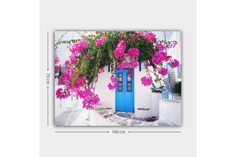 Lærred 70x100 cm - Smuk hvid bygning med en blå dør omgivet af lilla blomster - Lilla / Blå / Grøn - Boligtilbehør - Billeder & kunst - Billeder på lærred