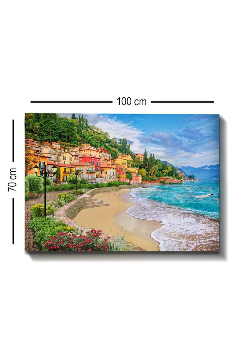 Lærred 70x100 cm - Smuk kystlinje med farverige huse, der klatrer op ad en frodig bakke ved en strand - Blå / Grøn / Gul - Boligtilbehør - Billeder & kunst - Billeder på lærred