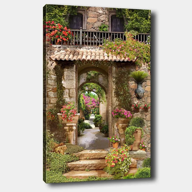 Lærred 70x100 cm - Smuk og frodig have med blomsterarrangementer og en stenbue, der fører ind til en grøn gangsti, Grøn / Lyserød / Beige