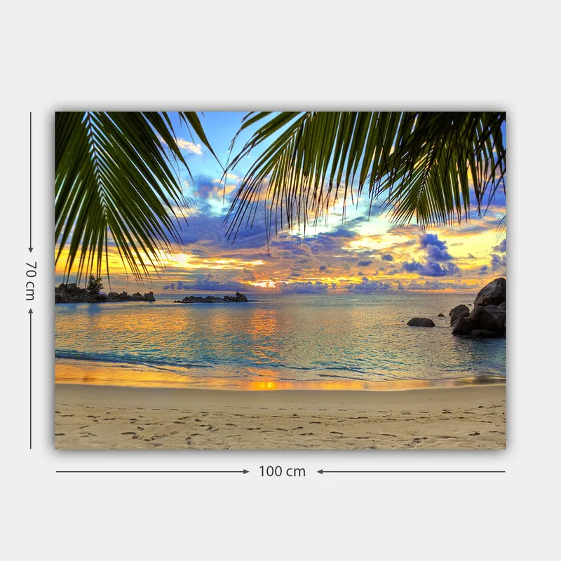 Lærred 70x100 cm - Smuk solnedgang over en strand med palmer, der indrammer motivet - Blå / Orange / Grøn - Boligtilbehør - Billeder & kunst - Billeder på lærred