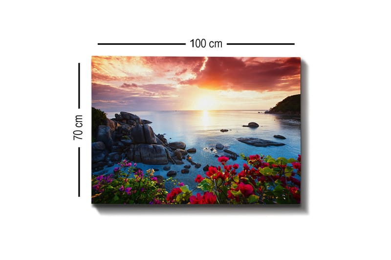 Lærred 70x100 cm - Smuk solnedgang over havet med klipper og farverige blomster i forgrunden - Lyserød / Blå / Orange - Boligtilbehør - Billeder & kunst - Billeder på lærred