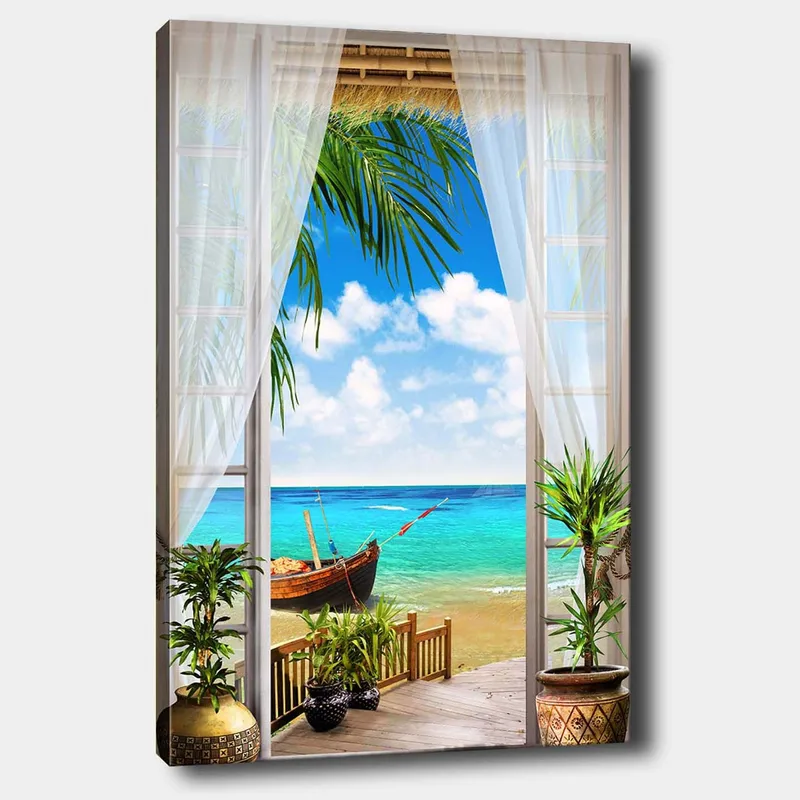 Lærred 70x100 cm - Smuk udsigt gennem et vindue med en strand, hav og en båd, Turkis / Blå / Grøn