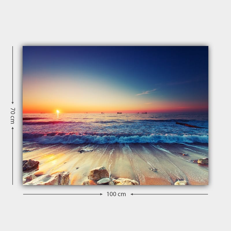 Lærred 70x100 cm - Solnedgang over havet med bløde bølger, der ruller ind mod kysten - Blå / Orange / Lyserød - Boligtilbehør - Billeder & kunst - Billeder på lærred