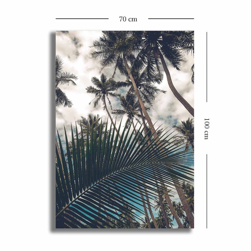 Lærred 70x100 cm - Tropisk palmelund med et stort palmeblad i forgrunden - Mørkegrøn / Lysegrøn / Blå - Boligtilbehør - Billeder & kunst - Billeder på lærred