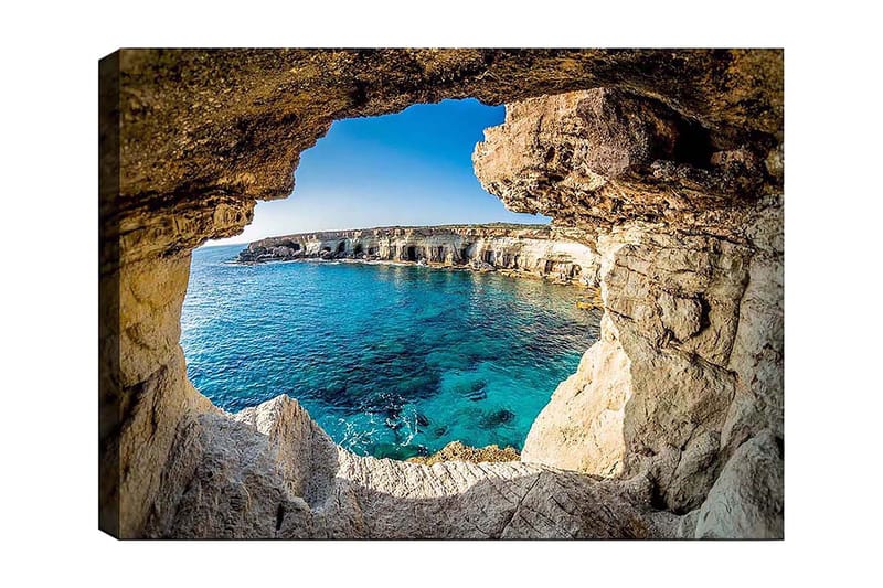 Lærred 70x100 cm - Udsigt gennem en klippeåbning mod en klar blå kyst, Blå / Beige / Hvid