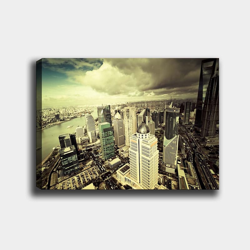Lærred 70x100 cm - Panoramaudsigt over en moderne by med høje skyskrabere og en flod, der flyder gennem landskabet - Grøn / Grå / Beige - Boligtilbehør - Billeder & kunst - Billeder på lærred