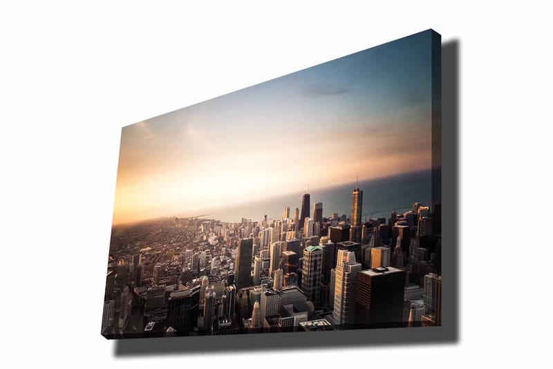 Lærred 70x100 cm - Panoramaudsigt over en by med høje skyskrabere og en solnedgang, der skaber en dramatisk atmosfære, Blå / Orange / Grå