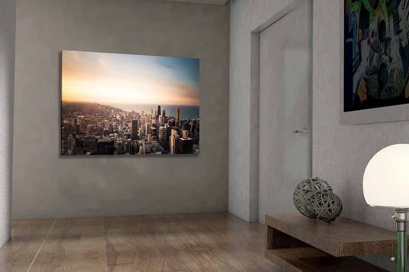 Lærred 70x100 cm - Panoramaudsigt over en by med høje skyskrabere og en solnedgang, der skaber en dramatisk atmosfære - Blå / Orange / Grå - Boligtilbehør - Billeder & kunst - Billeder på lærred