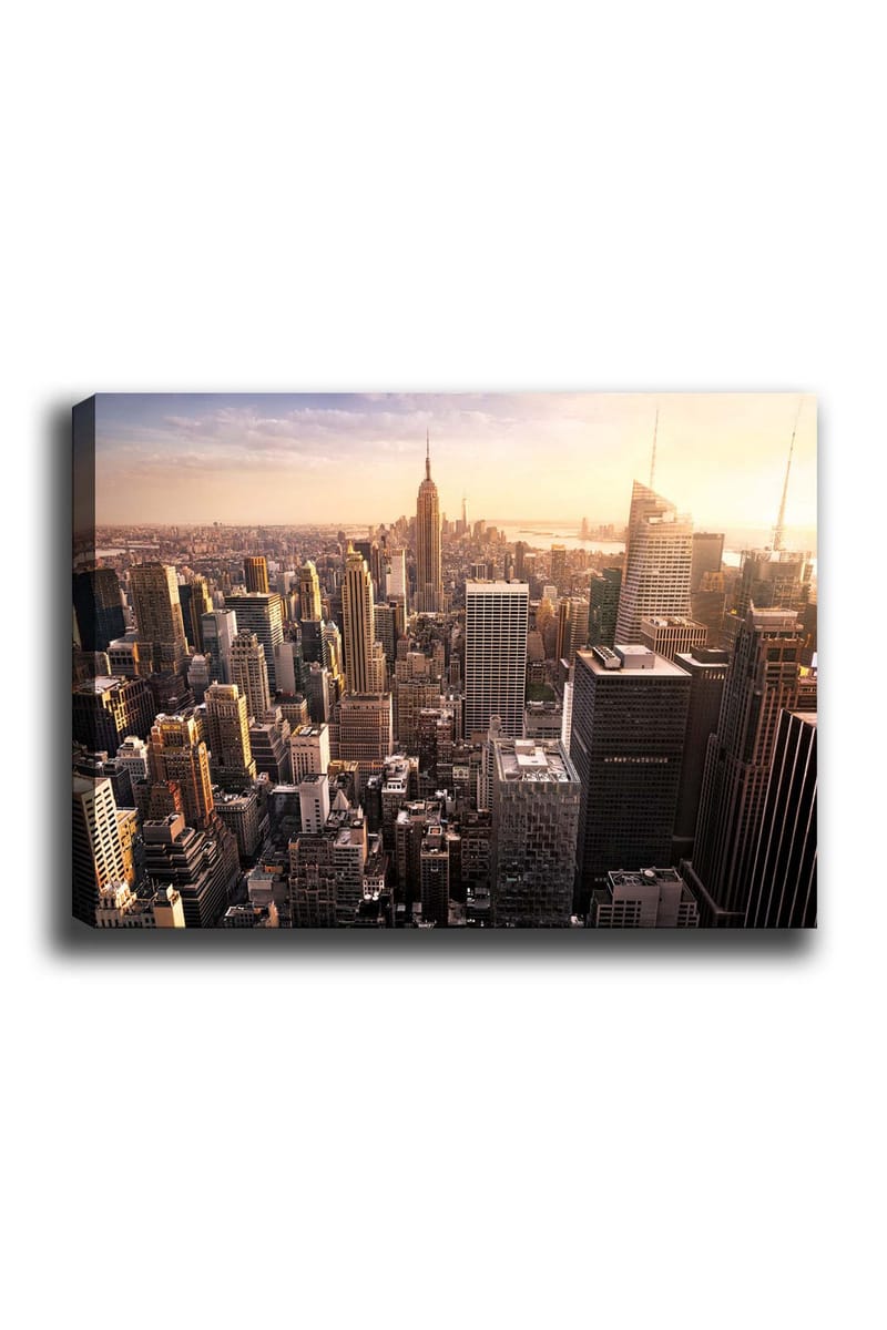 Lærred 70x100 cm - Panoramaudsigt over en by med skyskrabere og den ikoniske Empire State Building ved solnedgang, Guld / Grå / Blå