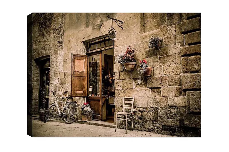 Lærredsbillede - Charmerende gadebillede med en cykel og en åben dør til en butik, Beige / Brun / Grøn