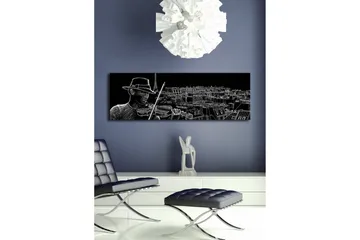 Lærredsbillede med LED-belysning 30x90 cm - Musiker spiller violin med en bysilhuet i baggrunden - Sort / Hvid - Boligtilbehør - Billeder & kunst - Billeder på lærred