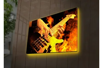 Lærredsbillede med LED-belysning 45x70 cm - Guitarist spiller elektrisk bas omgivet af flammende flammer - Orange / Sort / Gul - Boligtilbehør - Billeder & kunst - Billeder på lærred