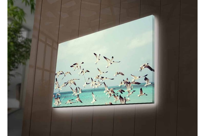 Lærredsbillede med LED-belysning - Flok fugle der flyver over en blå havoverflade - Lyseblå / Hvid / Sort - Boligtilbehør - Billeder & kunst - Billeder på lærred