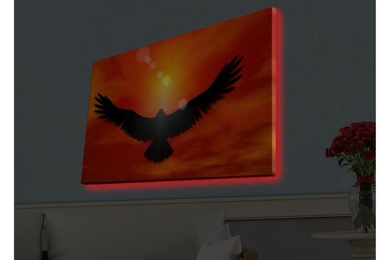 Lærredsbillede med LED-belysning - Silhuet af en ørn, der flyver mod en solnedgang i klare farver - Rød / Sort / Orange - Boligtilbehør - Billeder & kunst - Billeder på lærred
