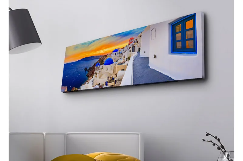 Lærredsbillede med LED-belysning - Smuk udsigt over hvide huse med blå kupler mod havet og en farverig solnedgang, Blå / Hvid / Orange