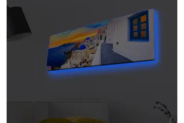 Lærredsbillede med LED-belysning - Smuk udsigt over hvide huse med blå kupler mod havet og en farverig solnedgang - Blå / Hvid / Orange - Boligtilbehør - Billeder & kunst - Billeder på lærred