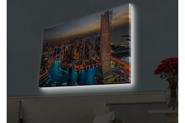 Lærredsbillede med LED-belysning - Storslået udsigt over en moderne by med glitrende skyskrabere og en snoet flod - Blå / Orange / Grå - Boligtilbehør - Billeder & kunst - Billeder på lærred