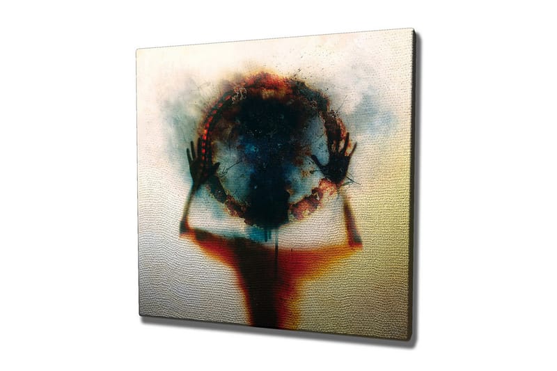 Lærredsbillede - Silhuet af en person, der holder en cirkel af farver og lys, Sort / Blå / Rød