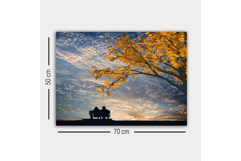Lærredsbillede - Silhuet af et par, der sidder på en bænk under et træ med gyldne efterårsblade - Guld / Blå / Sort - Boligtilbehør - Billeder & kunst - Billeder på lærred