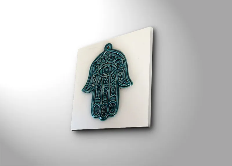 Lærredstryk 45x45 cm - Symbolsk hånd med øje og indviklede mønstre, Turkis / Hvid