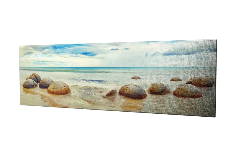 Lærredstryk 80x30 cm - Runde sten på en strand med hav og himmel i baggrunden - Blå / Beige / Grå - Boligtilbehør - Billeder & kunst - Billeder på lærred