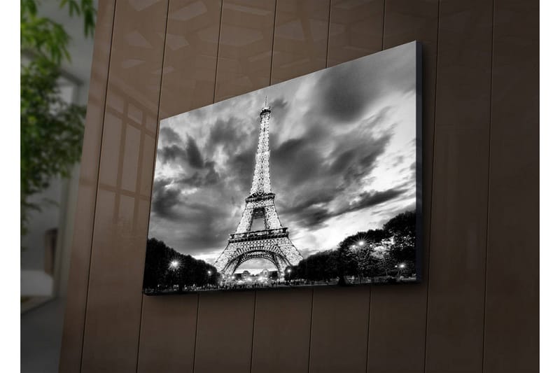 Lærredstryk med LED-belysning 45x70 cm - Dramatisk fotobillede af det oplyste Eiffeltårn i Paris med en overskyet himmel i sort-hvid - Sort / Hvid - Boligtilbehør - Billeder & kunst - Billeder på lærred