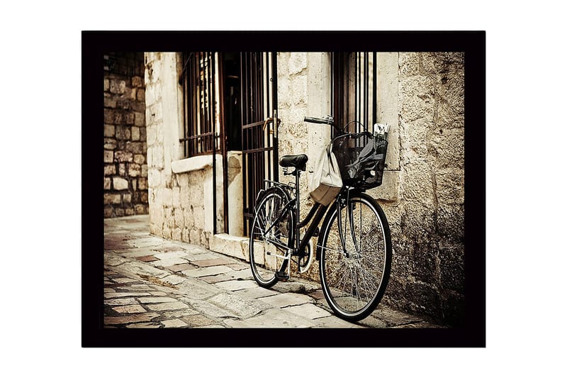 Indrammet lærred i træ - 41x56 cm - Cykel lænet op ad en gammel stenmur, Sort / Beige / Grå