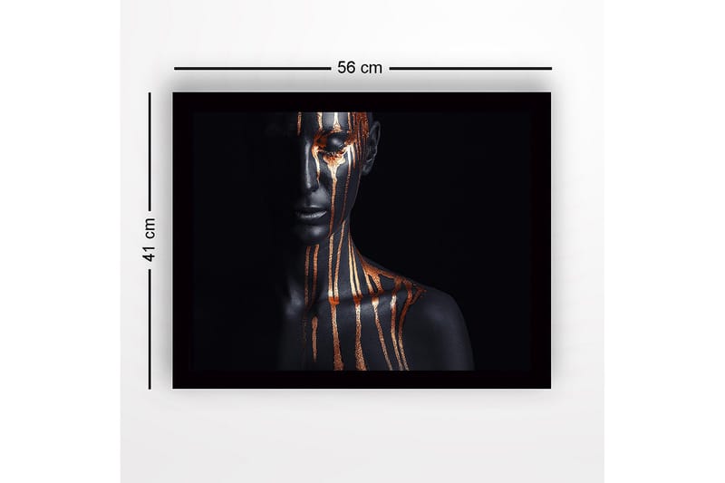 Indrammet lærred i træ - 41x56 cm - Mørk figur med guldstriber, der løber ned ad ansigt og krop - Sort / Guld - Boligtilbehør - Billeder & kunst