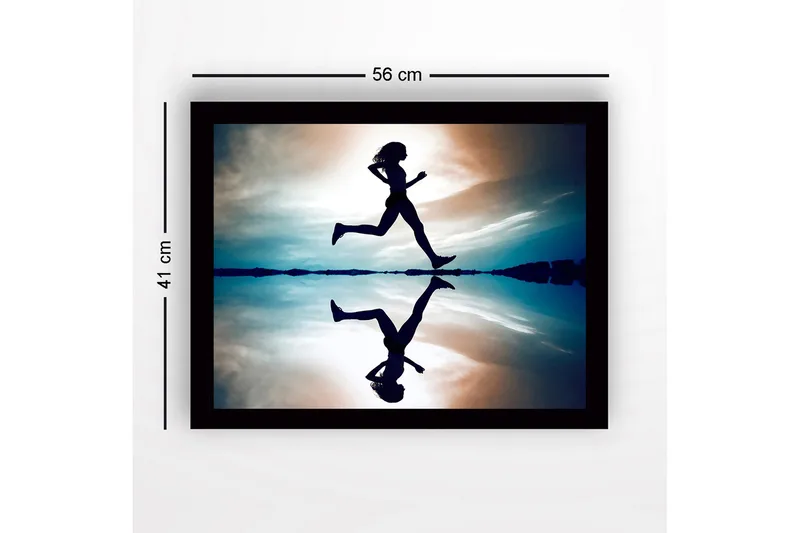 Indrammet lærredstryk i træ - 41x56 cm - Silhuet af en løber i bevægelse over en spejllignende overflade - Mørkeblå / Orange / Lyseblå - Boligtilbehør - Billeder & kunst