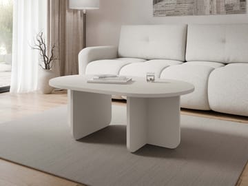 Ovren Aflangt Sofabord i Lyst Træ med Skulpturelle Benpaneler - Beige - Møbler - Borde - Sofabord